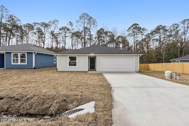 ranch-style house with a garage and a front lawn