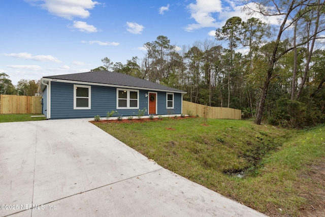 ranch-style home with a front lawn