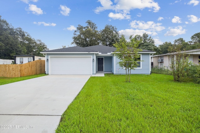 ranch-style home with a garage and a front lawn