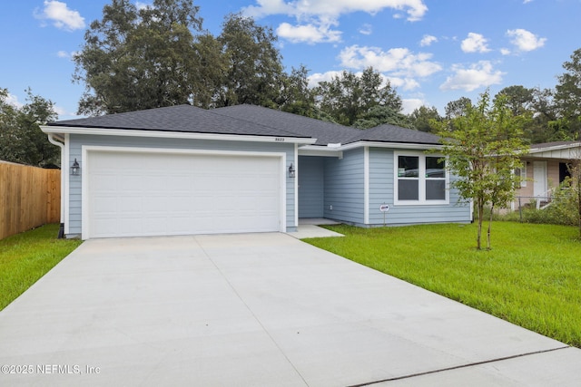 ranch-style house with a front lawn and a garage