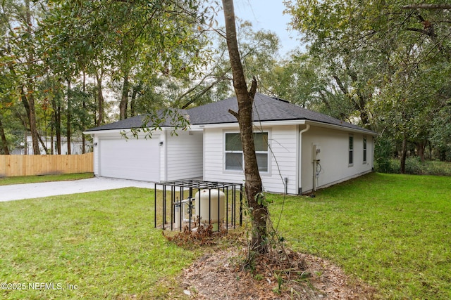 ranch-style home with a garage and a front lawn