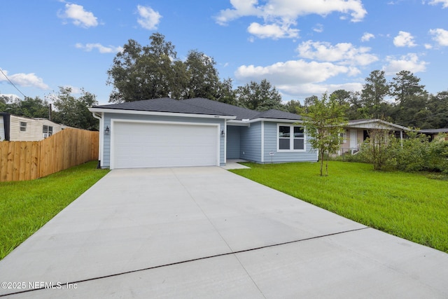 ranch-style home with a front yard and a garage