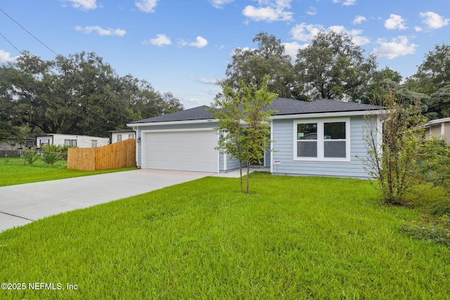 ranch-style house with a garage and a front lawn