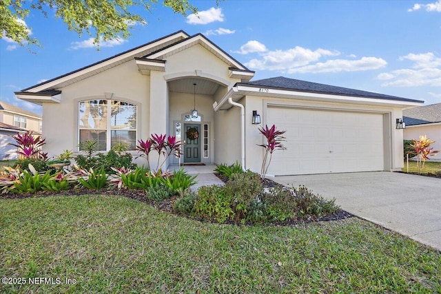 view of front facade featuring a garage and a front lawn