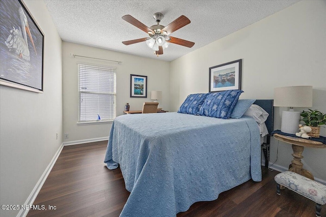 bedroom with a textured ceiling, ceiling fan, and dark hardwood / wood-style floors