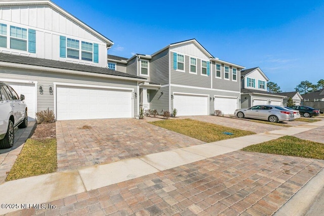 townhome / multi-family property featuring a garage