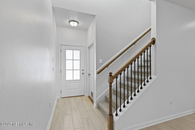 foyer entrance featuring light hardwood / wood-style floors