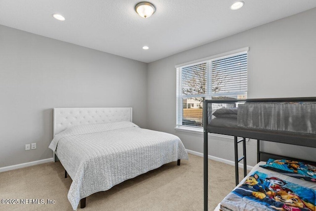 bedroom featuring light colored carpet