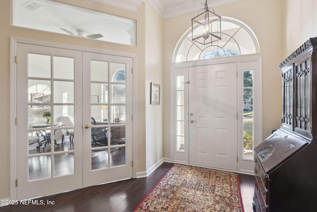 entryway featuring plenty of natural light, ceiling fan, french doors, and dark hardwood / wood-style floors