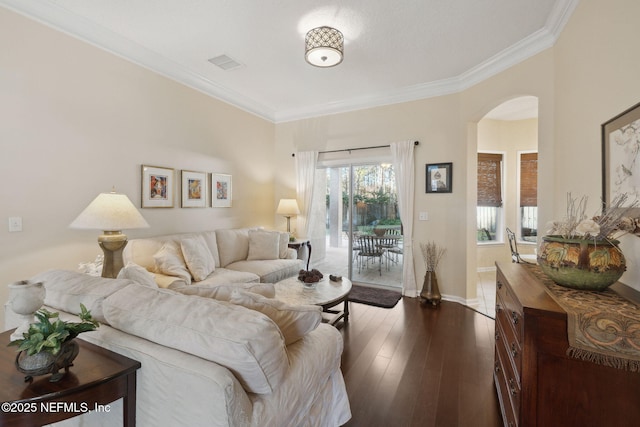 living room with crown molding and dark hardwood / wood-style flooring