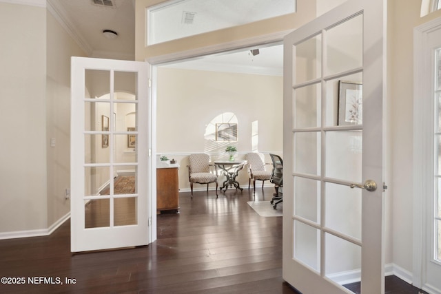 doorway featuring crown molding, french doors, and dark hardwood / wood-style floors