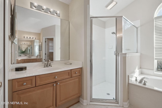 bathroom with separate shower and tub, tile patterned flooring, and vanity