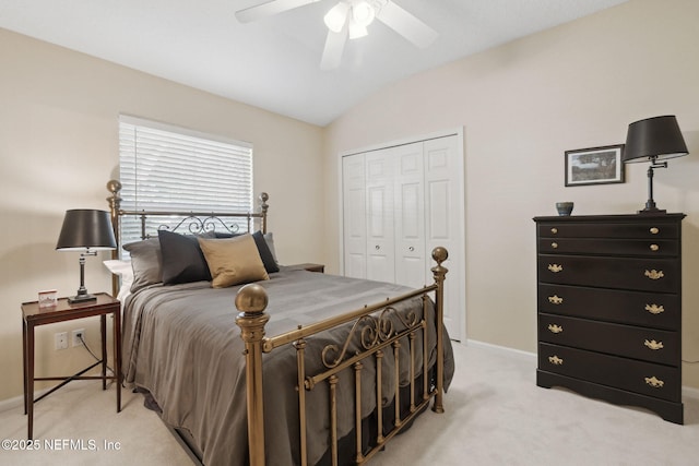 bedroom with light carpet, a closet, ceiling fan, and lofted ceiling