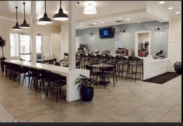 dining area featuring light tile patterned floors