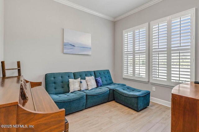 living room with light wood-type flooring and crown molding