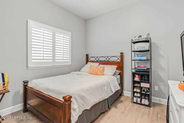 bedroom with light wood-type flooring