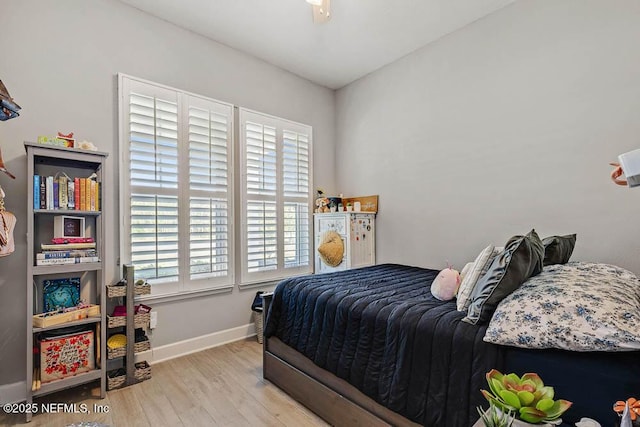 bedroom with light hardwood / wood-style floors