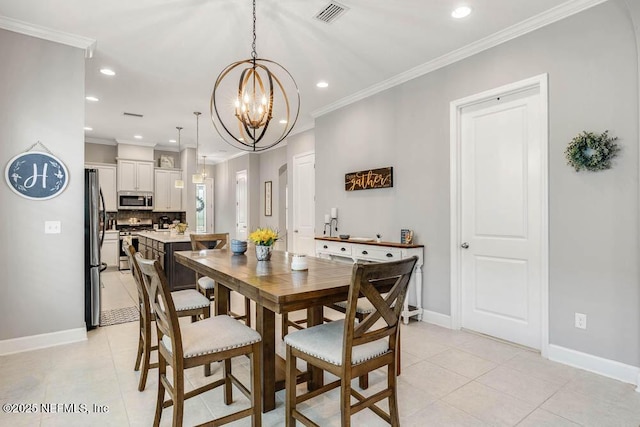 dining area featuring light tile patterned floors, crown molding, and a notable chandelier