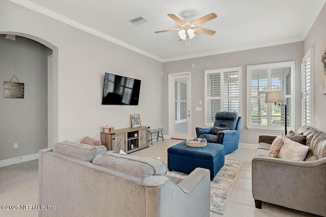 tiled living room featuring ceiling fan and ornamental molding