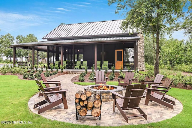 view of patio / terrace featuring a fire pit