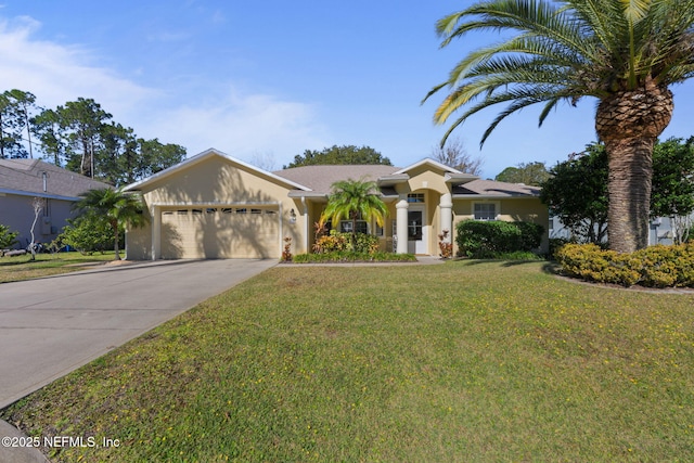 view of front facade with a garage and a front yard