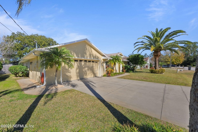 view of front of home featuring a garage and a front yard