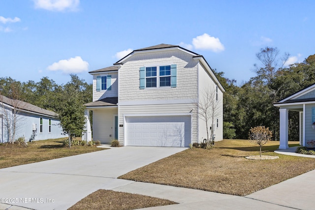 view of front property featuring a garage and a front yard