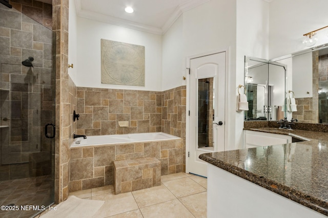 bathroom with tile patterned flooring, vanity, ornamental molding, and plus walk in shower