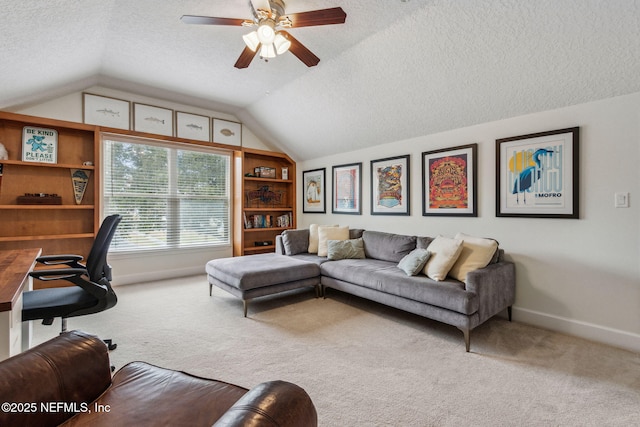 interior space with carpet, ceiling fan, and vaulted ceiling