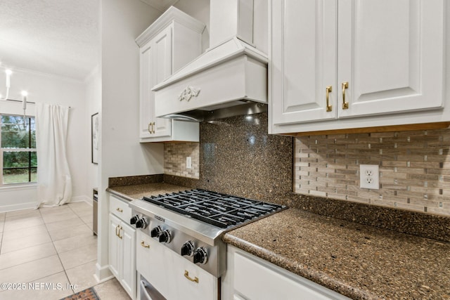 kitchen featuring white cabinets, light tile patterned floors, stainless steel gas stovetop, and custom exhaust hood