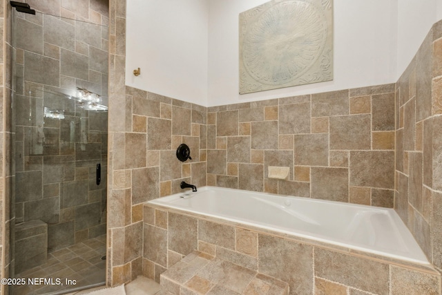 bathroom with separate shower and tub