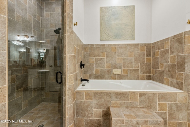 bathroom with separate shower and tub