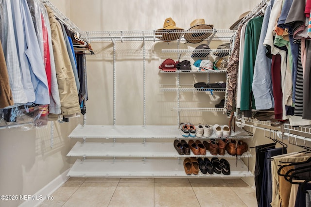 spacious closet featuring tile patterned floors