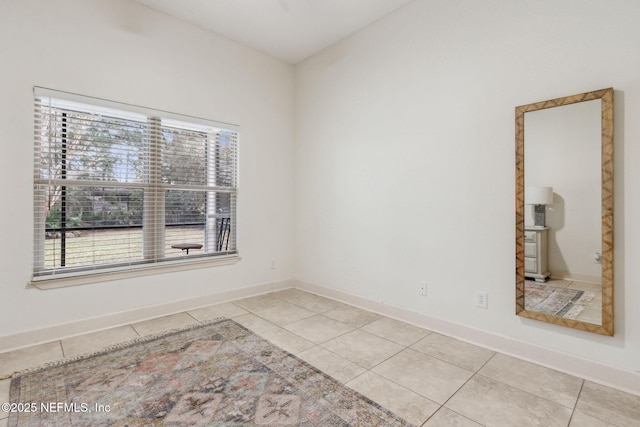 spare room featuring light tile patterned floors