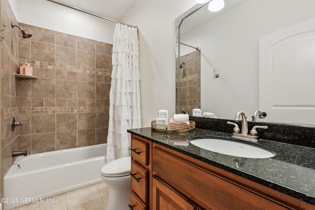 full bathroom with tile patterned floors, vanity, toilet, and shower / tub combo