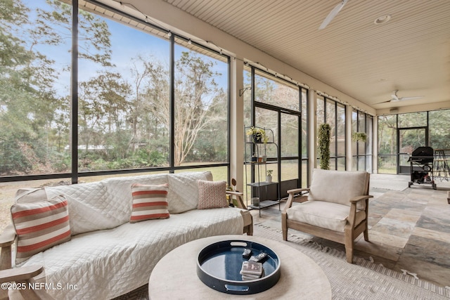 sunroom with a wealth of natural light and ceiling fan