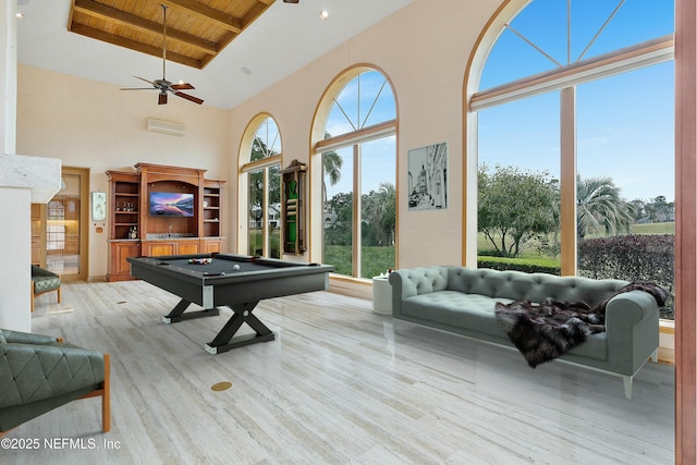 game room with a high ceiling, a wealth of natural light, wooden ceiling, and pool table