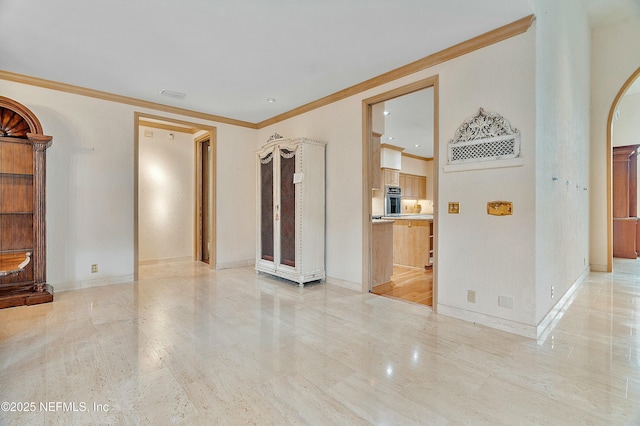 spare room featuring crown molding