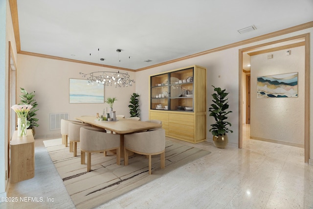 dining area featuring a notable chandelier and ornamental molding