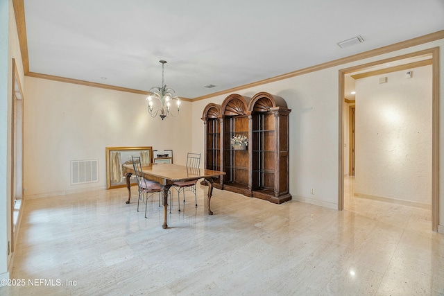 dining area with crown molding and an inviting chandelier