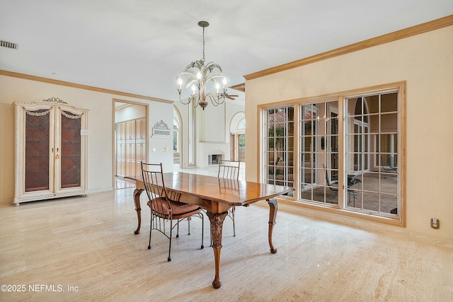 dining room featuring crown molding and an inviting chandelier