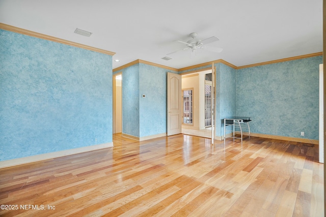 empty room with wood-type flooring, ceiling fan, and crown molding