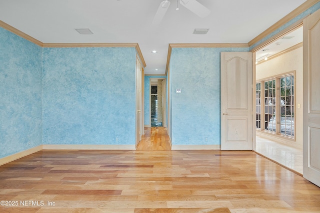 empty room featuring ceiling fan, crown molding, and light hardwood / wood-style flooring