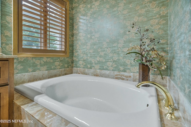 bathroom with tiled tub