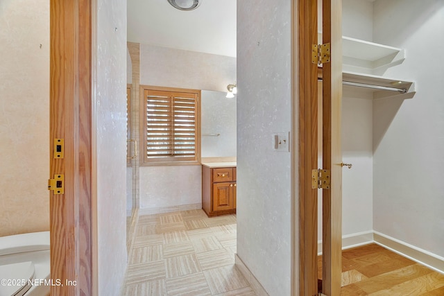 bathroom featuring hardwood / wood-style floors, vanity, and toilet