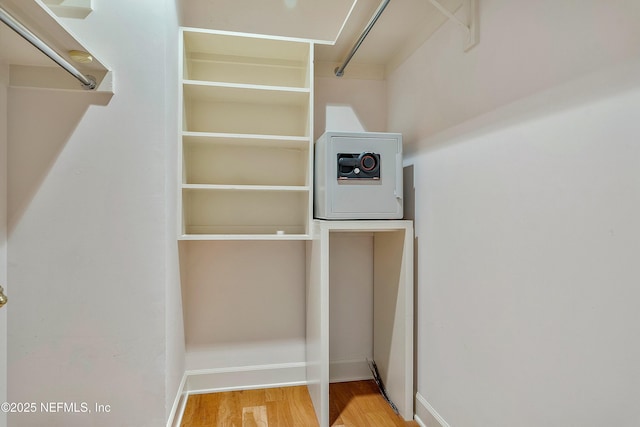 spacious closet featuring hardwood / wood-style floors