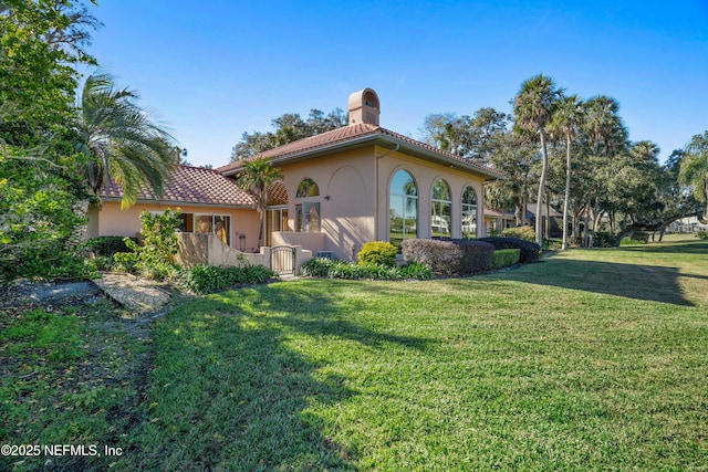 view of property exterior with a yard