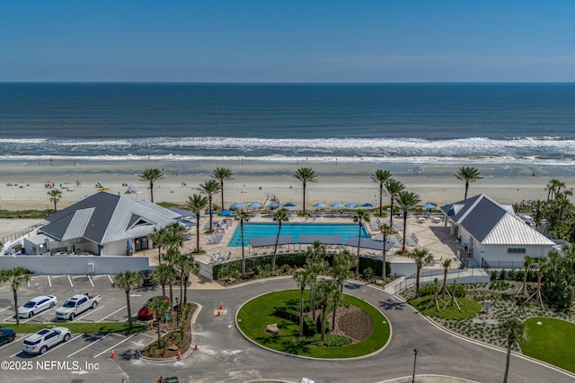 aerial view featuring a water view and a view of the beach