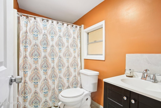 bathroom with toilet and vanity