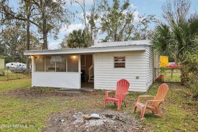 back of house with a sunroom